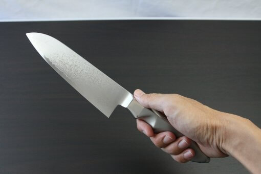 Japanese Chef Knife, Damascus Santoku Multi-purpose, grabbed by hand
