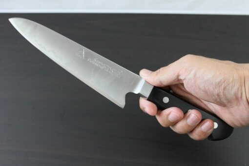 Japanese Highest Quality Chef Knife, Tohu Powder high-speed steel Series, Gyuto chef knife 180mm, grabbed by a man's hand