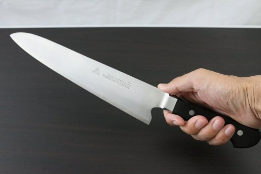 Japanese Highest Quality Chef Knife, Tohu Powder high-speed steel Series, Gyuto chef knife 240mm, grabbed by a man's hand