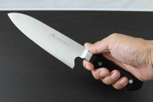 Japanese Highest Quality Chef Knife, Tohu Powder high-speed steel Series, Santoku multi-purpose knife, grabbed by a man's hand