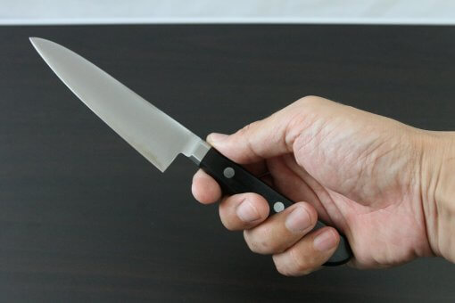Japanese Highest Quality Chef Knife, Tohu Powder high-speed steel Series, petit knife 120mm, grabbed by a man's hand