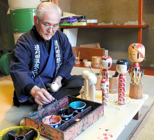 Japanese Traditional Wood Carving Dolls, Kokeshi, craftsman making kokeshi painting