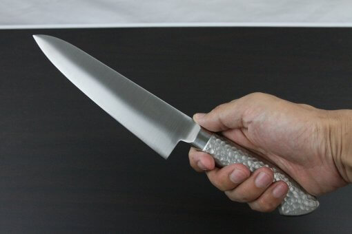 Japanese Chef Knife, Elegance Monaka Series, Gyuto chef knife 180mm, grabbed by a man's hand