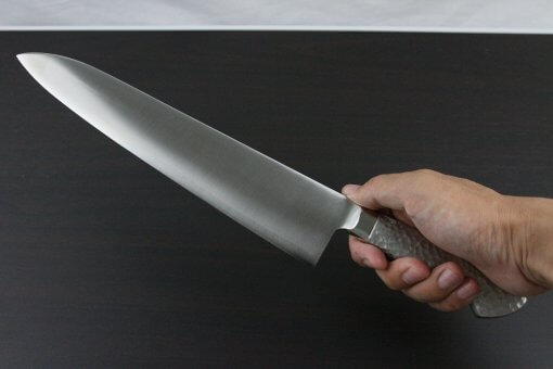 Japanese Chef Knife, Elegance Monaka Series, Gyuto chef knife 270mm, grabbed by a man's hand