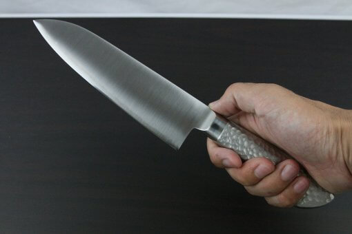 Japanese Chef Knife, Elegance Monaka Series, Santoku multi-purpose knife 180mm, grabbed by a man's hand
