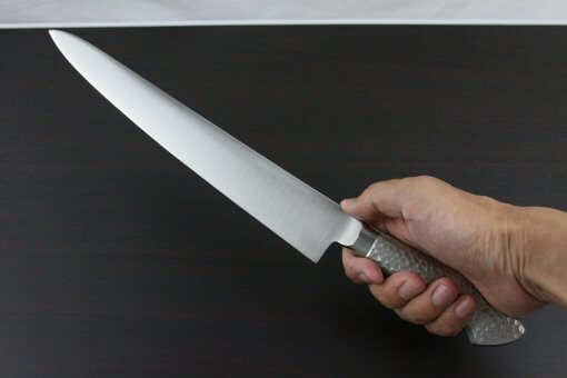 Japanese Chef Knife, Elegance Monaka Series, Sujikiri slicing knife 270mm, grabbed by a man's hand