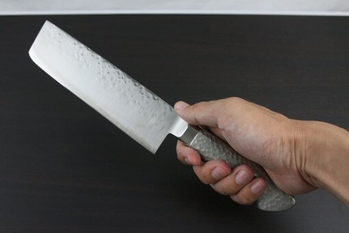 Japanese Chef Knife, Hammer Finish Series, Nakiri Vegetable knife, grabbed by a man's hand