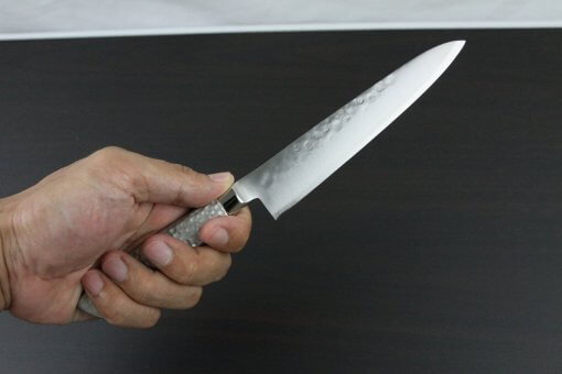 Japanese Chef Knife, Hammer Finish Series, Petit knife 150mm left-handed, grabbed by a man's hand