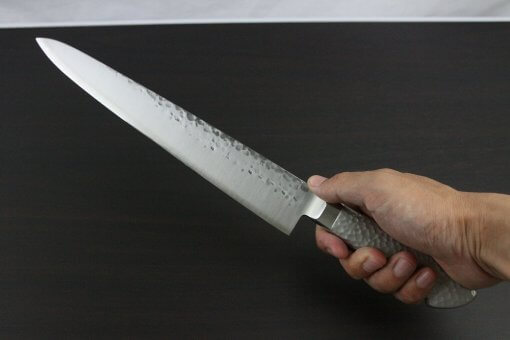 Japanese Chef Knife, Hammer Finish Series, Sujihiki Slicing Knife 270mm, grabbed by a man's hand