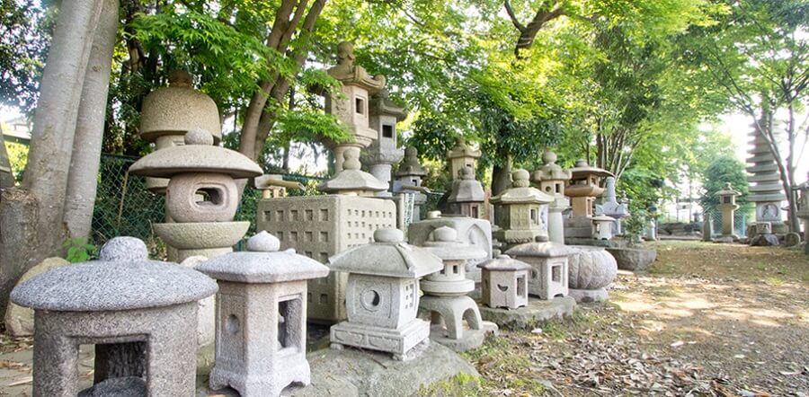 Traditional Makabe Stone Lanterns of Japan, bunch of lanterns in a forest