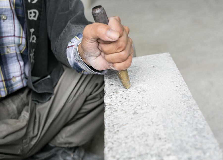 Traditional Makabe Stone Lanterns of Japan, craftsman is making by hand