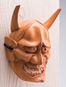 Hida Ichii one-knife carving, a Japanese traditional craft, diagonal front view of oni mask