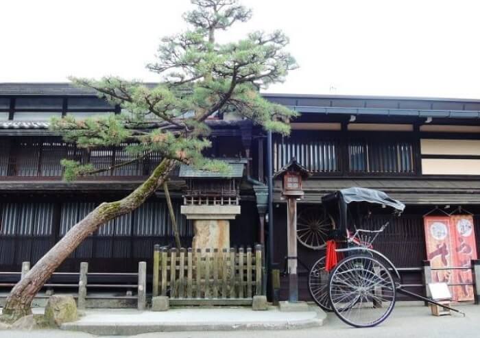 Hida Shunkei Lacquerware, a Japanese traditional craft, rikshaw in front of an old housing