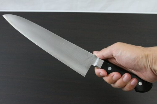 Japanese Chef Knife, Toshu super blue steel Aogami Super, Gyuto chef knife 240mm, grabbed by a man's hand
