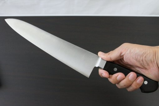 Japanese Chef Knife, Toshu super blue steel Aogami Super, Gyuto chef knife 240mm, grabbed by a man's hand