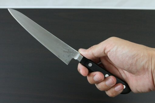 Japanese Chef Knife, Toshu super blue steel Aogami Super, petit knife 150mm, grabbed by a man's hand