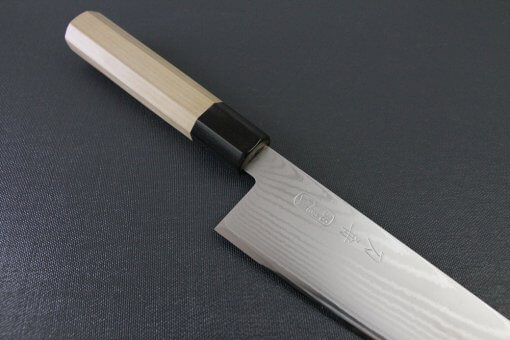 Toshu Santoku multi-purpose Japanese chef's knife, damascus blade and octagonal wood handle, diagonal front view