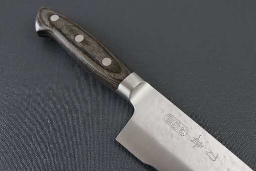 Toshu Santoku multi-purpose Japanese chef's knife, hammered finish blade and gray handle, diagonal front view