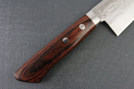 Toshu Santoku multi-purpose Japanese chef's knife, hammered finish blade and mahogany handle, details of handle