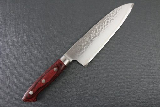 Toshu Santoku multi-purpose Japanese chef's knife, hammered finish blade and red handle, entire front view