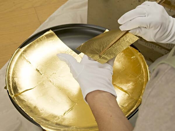 Kanazawa gold leafe, a Japanese traditional craftsmanship, pasting process to lacquer tray