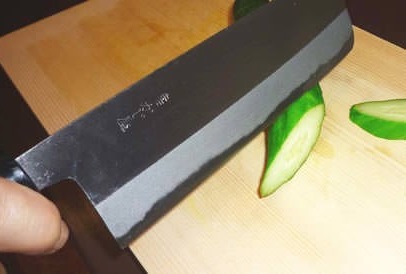 Nakiri Japanese vegetable knife, cutting cucumber