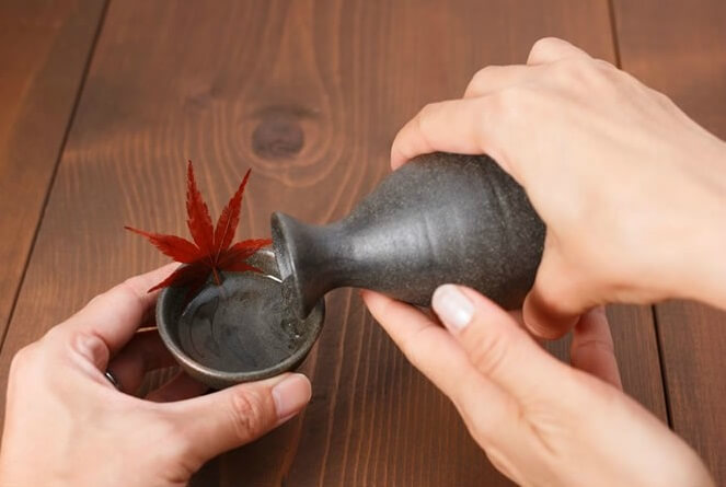 pouring Sake into a cup
