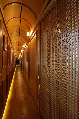 Seven Stars in Kyushu, cruise train of Japan, corridor decorated with Ohkawa woodworks