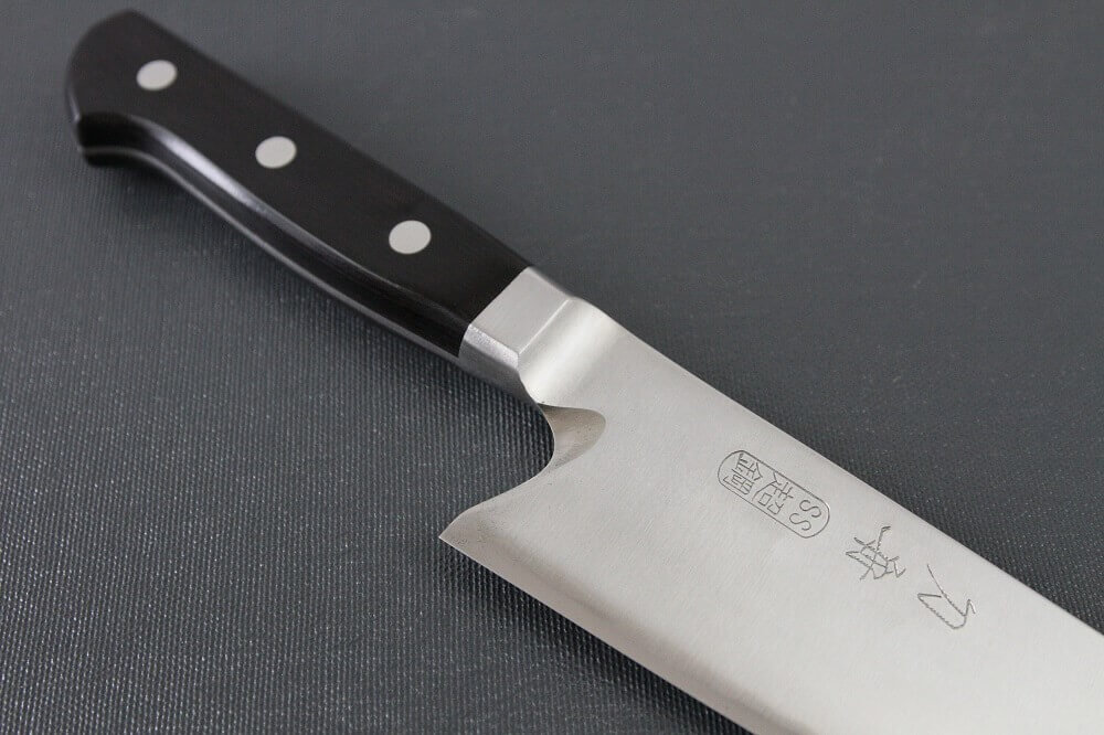 Japanese Santoku knife for professionals and home kitchen, diagonal front view