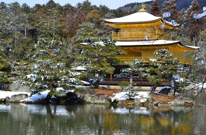 Kinkakuji temple in winter, snow cap on its roof