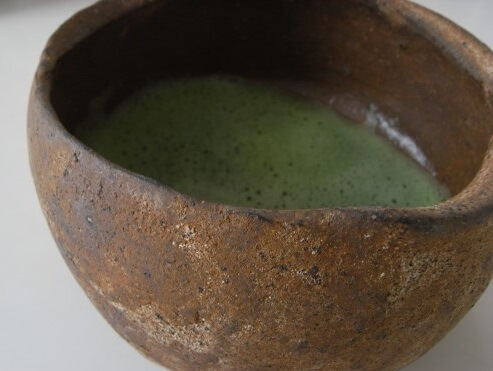 Japanese Tea ceremony, old aged cup with green tea